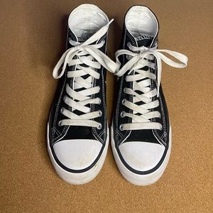 Black high tops that look exactly like converse without the logo